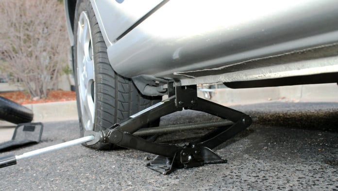 Woman To Shelve Belief That Gender Is Social Construct For Few Minutes While Boyfriend Changes Flat Tire On Side Of Road