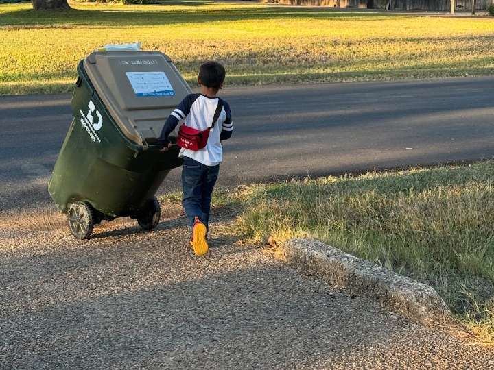 I don't give my 7-year-old an allowance. Instead, he runs a neighborhood business, where neighbors pay him to take out their trash.