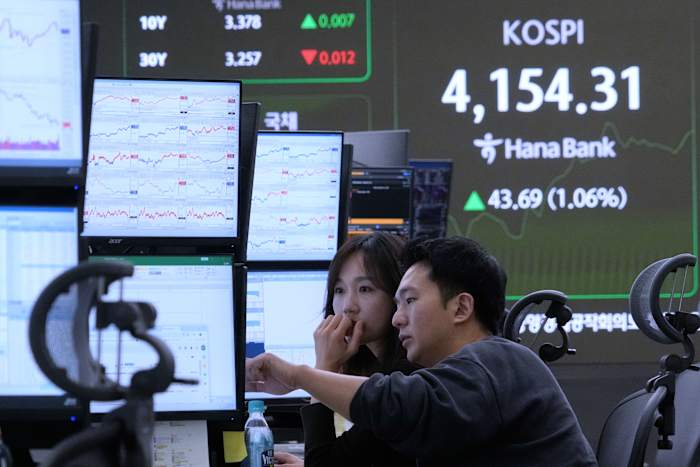 Asian shares track US stock market's rise to record highs despite AI bubble worries