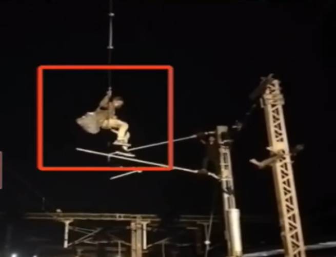 Youth climbs high-voltage power pole at Valsad railway station