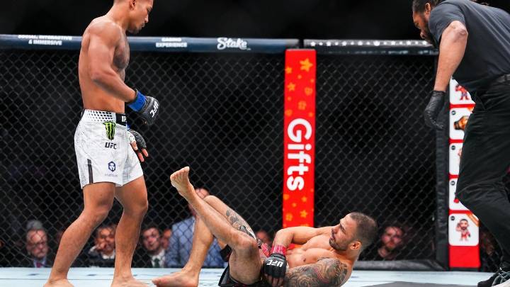 Van wins flyweight title after Pantoja injures arm at UFC 323