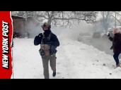 Illinois Street Erupts in Smoke as Crowd Pelts Officers With Snowballs