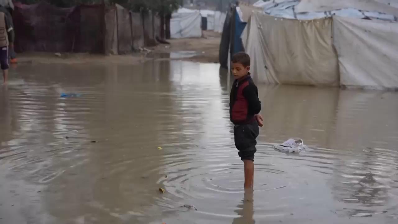 Rain drenches tent camps in central Gaza as winter storm continues in the war