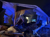 Car hits home in Kalamazoo, injuring person inside living room