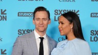 Tom Hiddleston makes rare red carpet appearance with fiancée Zawe Ashton in sweeping red gown