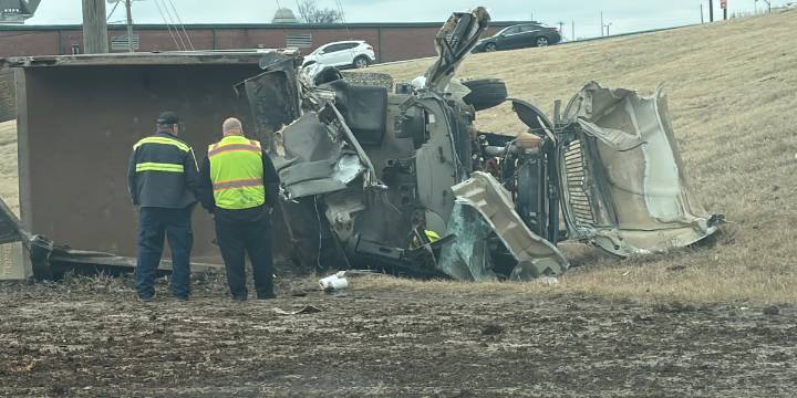 Driver survives after dump truck breaks through guard rail, flips down slope in Nashville