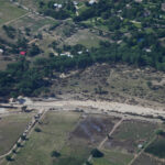 911 callers trapped in flooded attics and inundated camp cabins beg for help as floodwaters rise