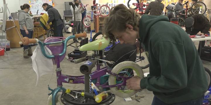 Volunteers fix and clean bicycles to gift to Eastern Iowa’s families for Christmas