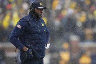 Michigan’s Moore fired, later detained
