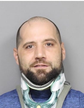 Utica man charged after threatening to return to hospital with gun