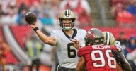 Tyler Shough's heroics — and a late defensive stand — earn the Saints a win in rainy Tampa
