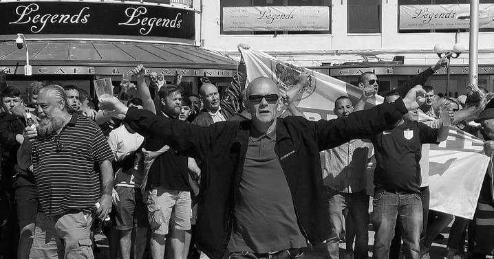 Football fanatic dies after falling while hanging flag on lamppost