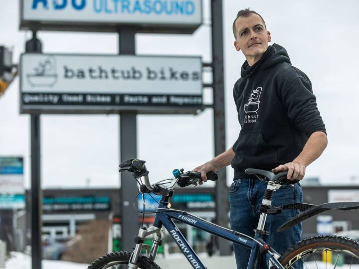 Calgary bike shop owner celebrates new sign after five
