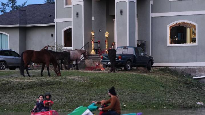 Arctic air sweeps south as residents of the Pacific Northwest remain on guard after severe flooding