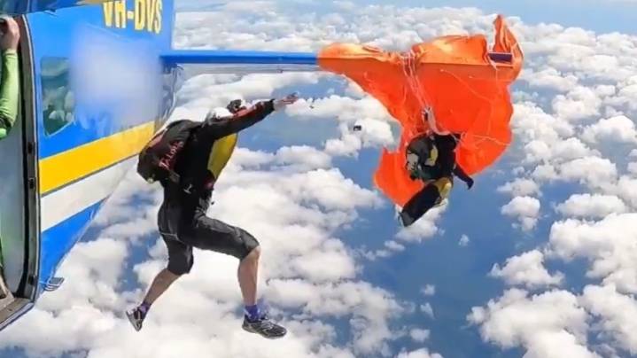 Skydiver's parachute gets caught in plane, they cut it at 15,000 feet to survive