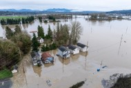 Arctic air sweeps south as residents of the Pacific Northwest remain on guard after severe flooding