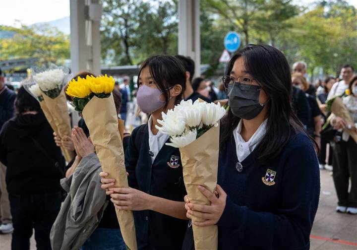 Hong Kong fire probe reveals unsafe netting as public mourns and government stifles dissent