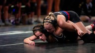 Raccoon River Wrestling's Mya Van Beek locks up clutch pin vs. Ankeny