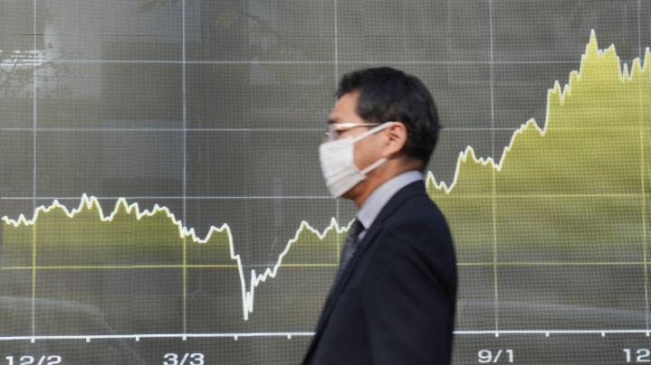 Asian shares slip after Wall Street pulls back from its record heights