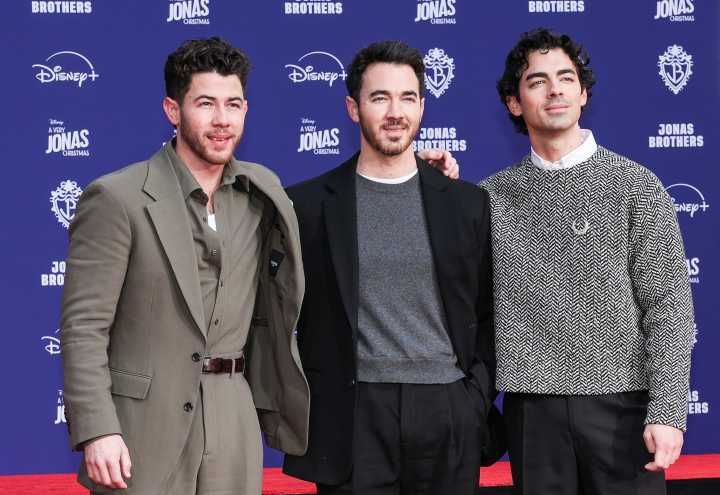 The Jonas Brothers leave handprints, footprints at iconic Hollywood theater