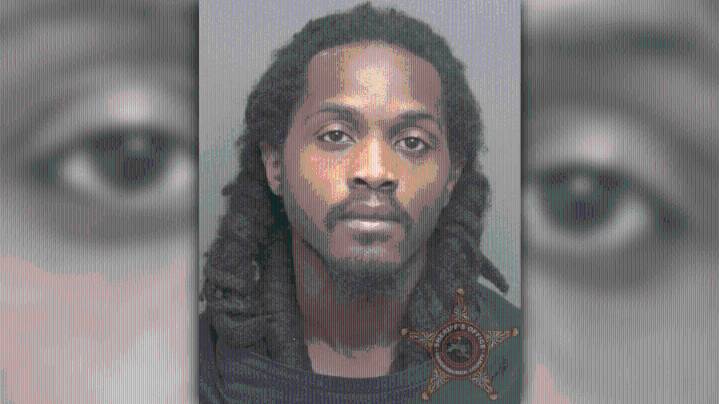 Man arrested after gun fired in neighbor dispute