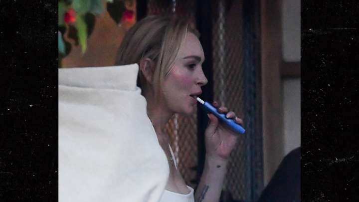 Lindsay Lohan Vapes, Eats Ice Cream in Miami With Husband, Son