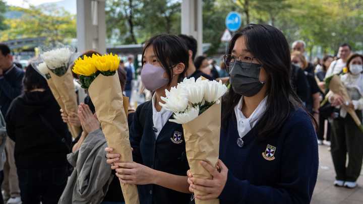 Hong Kong fire probe reveals unsafe netting as public mourns and government stifles dissent