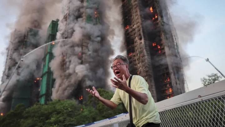 The family tragedy behind the viral photo of the Hong Kong fire