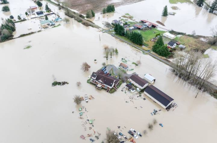 Tens of thousands ordered to flee flooding after torrential rain in Pacific Northwest