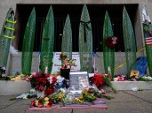 Man charged in National Guard shooting pleads not guilty from hospital bed