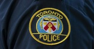 Toronto police say officer pulled woman on fire from tent