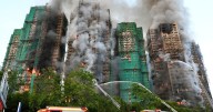 Hong Kong fire: Officials say netting on buildings did not meet code as death toll hits 151