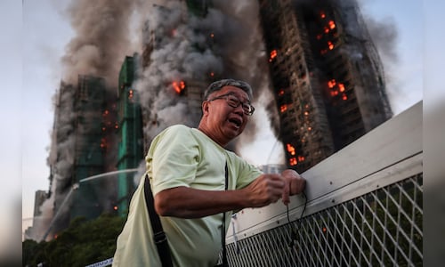 'Highly traumatised': Hong Kong presses ahead with elections after deadly fire