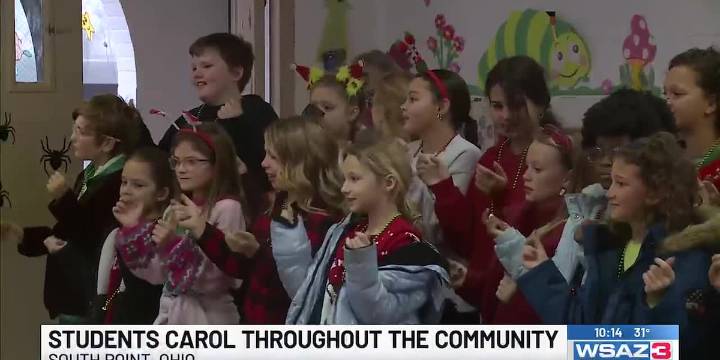 Burlington Elementary School students carol throughout the community