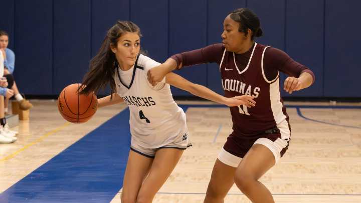Aquinas beats Mercy in girls hoops. See the photos