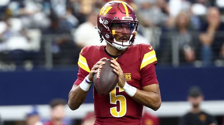 Commanders’ Jayden Daniels re-injures elbow after getting flattened on INT return