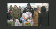 Madison police shop for toys to donate to local children for the holidays