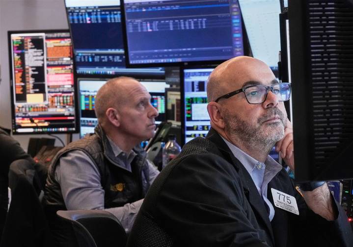 Wall Street hangs near its all-time high as calm continues to hold