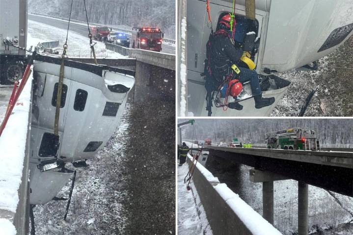 Truck driver rescued after dangling 100-feet in the air off West Virginia highway