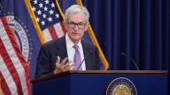 Federal Reserve cuts interest rates in divisive vote