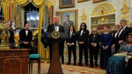Trump awards medals to the Kennedy Center honorees in an Oval Office ceremony