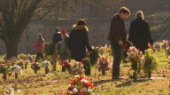 Volunteers place wreaths on graves of veterans at Valhalla Memory Gardens