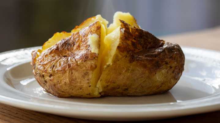 The Best Baked Potato Topping Is Simple, Flavorful, And Can Be Grown In Your Kitchen