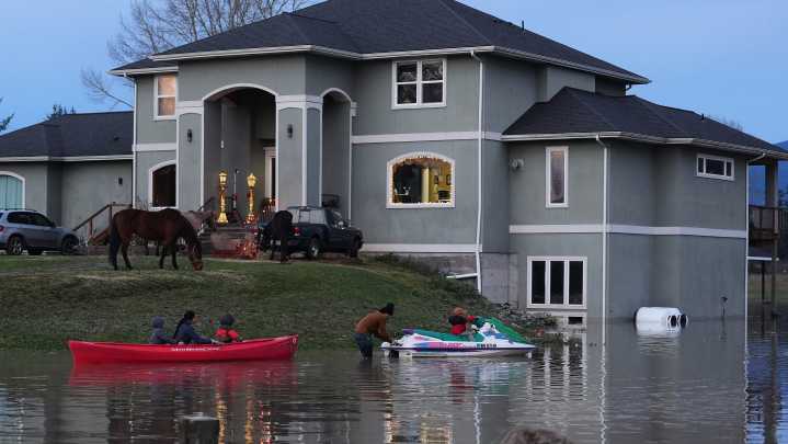 Arctic air sweeps south as residents of the Pacific Northwest remain on guard after severe flooding