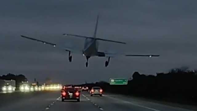 Family helps woman in car struck by plane