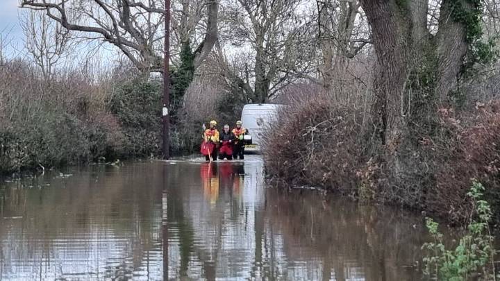 Stranded motorist rescued by firefighters after driving into flood water in Shropshire village