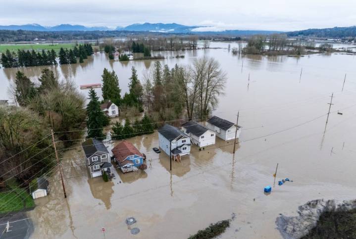 Arctic air sweeps south as residents of the Pacific Northwest remain on guard after severe flooding