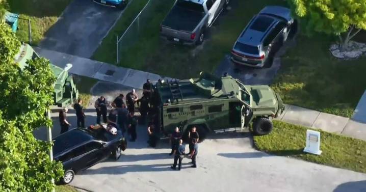 Armed person shot, killed in Southwest Miami-Dade by deputies serving search warrant in child porn probe, officials say