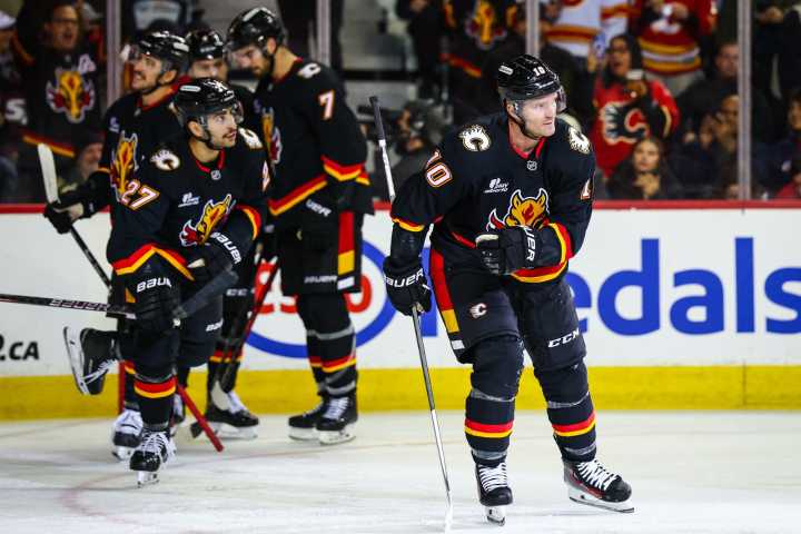 Flames dominate late to douse Wild point streak