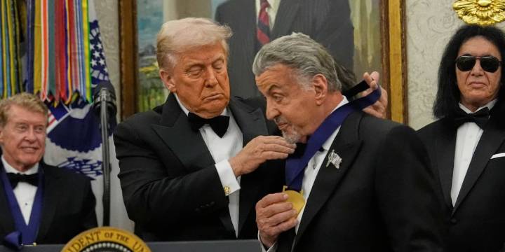 Trump awards medals to the Kennedy Center honorees in an Oval Office ceremony